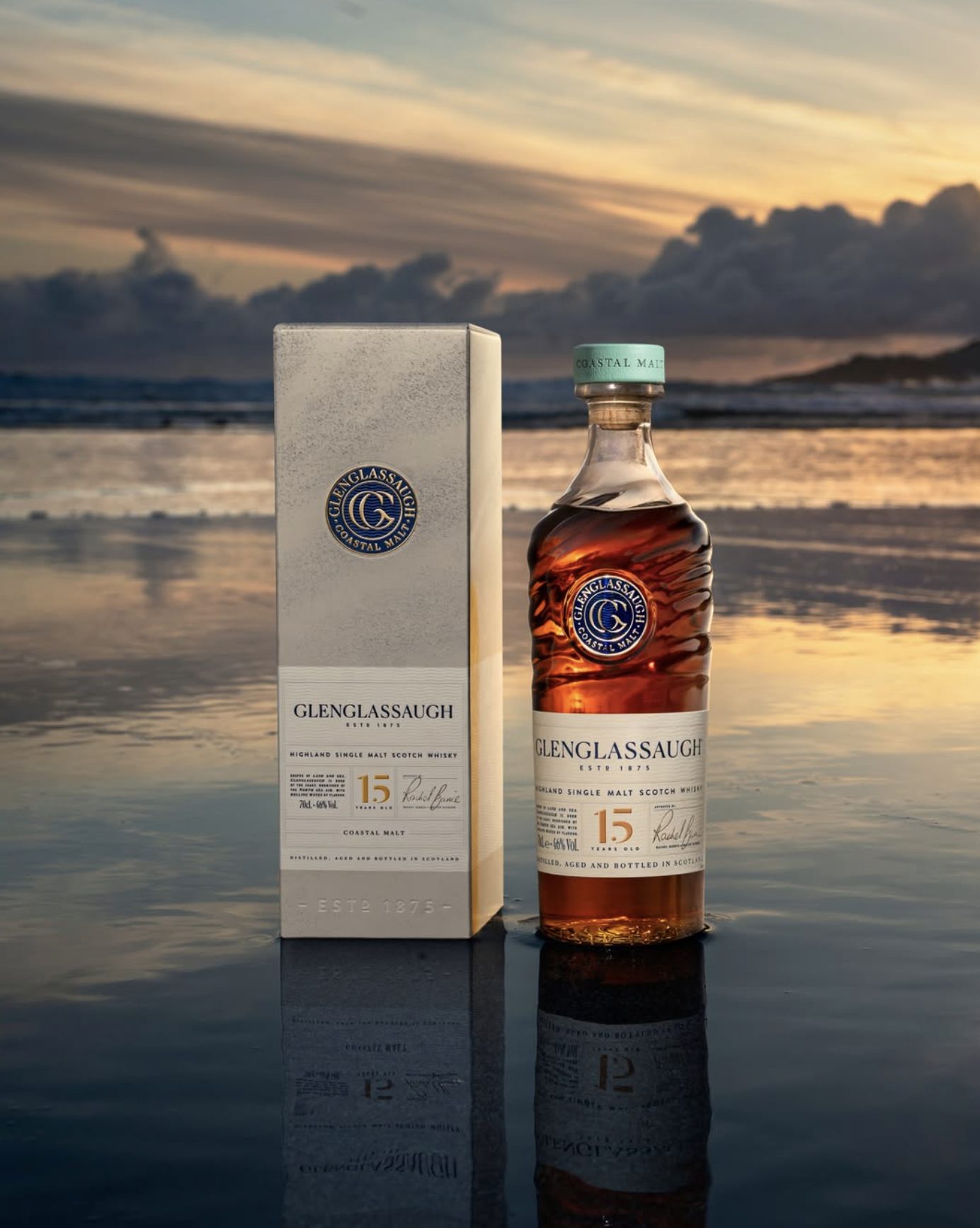 Glenglassaugh 15 Years Old 70cl bottle and gift box on Sandend Bay beach at sunset, Highland single malt 2026