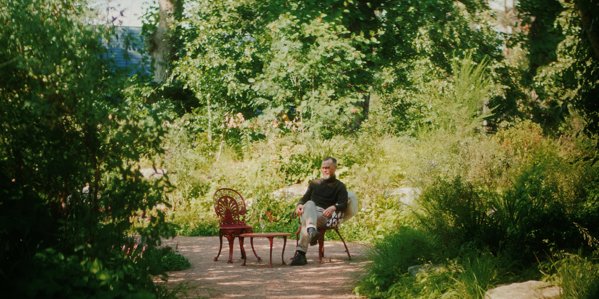 Joel Harrison tasting The Garden at Hazelwood 47-Year-Old Blended Malt in the gardens at the Fife Arms, Braemar