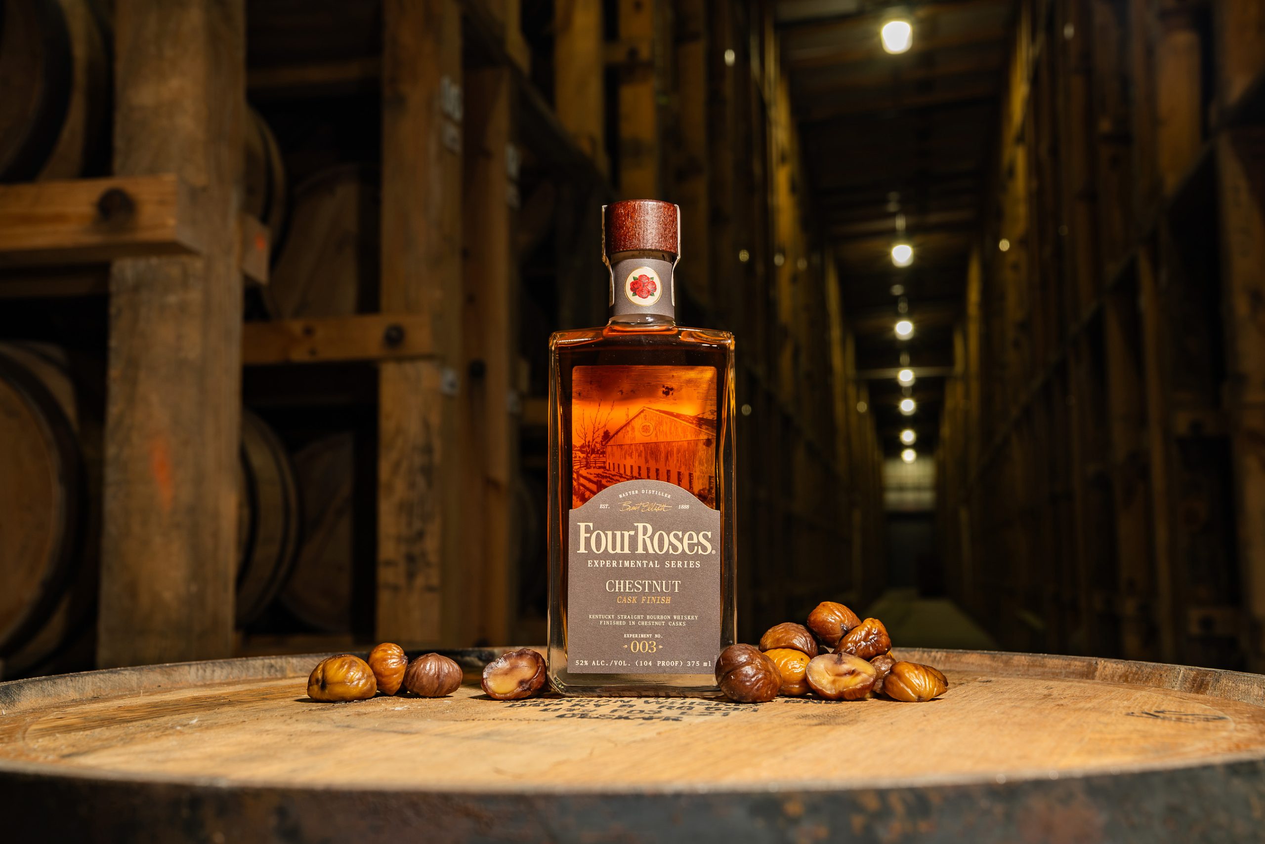 Four Roses Experimental Series No. 003 Chestnut Cask Finish 375ml bottle on a barrel head with chestnuts, Kentucky straight bourbon 2026
